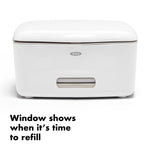 Front-facing white OXO wipe dispenser with small window and product message below
