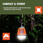 Orange Ozark Trail bug zapper lantern hanging from a hook outdoors, glowing and showing internal zapper grid
