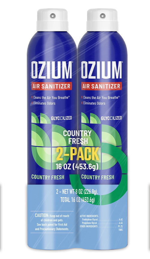 Two tall blue Ozium air sanitizer cans side-by-side showing Country Fresh 2-pack packaging and front label graphics.