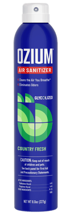 Tall blue aerosol can of OZIUM air sanitizer Country Fresh scent with white cap and green circular graphic