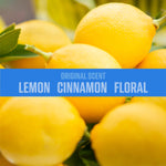Close-up photo of lemons with a blue banner listing scent notes: Original Scent, Lemon, Cinnamon, Floral.