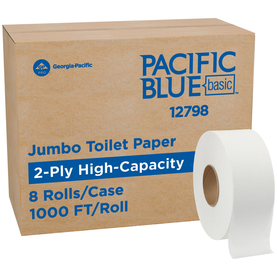 Cardboard case labeled PACIFIC BLUE basic with a jumbo toilet paper roll beside it