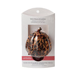 Packaged tortoiseshell pumpkin fragrance plug set visible through retail blister packaging with branding at top