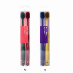 Two clear plastic packs each containing a pair of colored toothbrushes labeled RG and YL, shown on white background.
