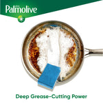 Stainless pan being scrubbed with a blue scouring sponge showing foam and Palmolive branding with 'Deep Grease‑Cutting Power' text