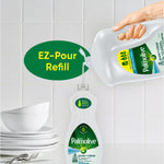 Hand pouring Palmolive pure+clear EZ-pour refill into a smaller Palmolive bottle over dishes and bowls