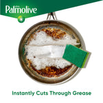 Top-down view of a greasy frying pan being scrubbed with soap suds and a green scrub sponge, Palmolive branding
