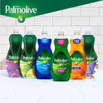 Row of various Palmolive dish soap bottles in different formulas arranged on a counter with brand banner above