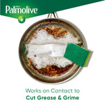 Top-down view of a greasy pan being scrubbed with a green scrub sponge and Palmolive branding in the corner