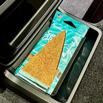 Paradise Air Super Organic Tsunami pack with triangular insert shown inside a car center console compartment