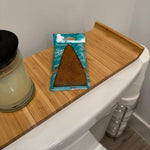 Paradise Air Super Organic Tsunami pack with triangular brown air freshener placed on a wooden tray