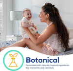 Parent holding a happy baby on a bed with a botanical icon and the word "Botanical" in a product graphic.
