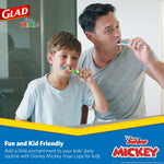Adult and child brushing their teeth together in a bathroom; Glad for Kids branding appears in the graphic border.