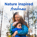 Parent hugging a child outdoors in front of trees with headline 'Nature inspired freshness' over the photo