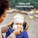 Adult wiping a child's nose with a tissue inside a stylized shield graphic and 'Clean and comforted skin' text