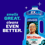 Partial view of a blue Mr. Clean bottle next to text reading "smells GREAT. cleans EVEN BETTER." on a dark purple background