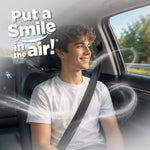 Smiling passenger in a car with swirling fragrance graphics and 'Put a Smile in the Air' Little Joe branding