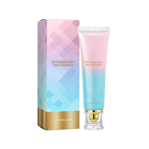 Pastel pink and blue gradient toothpaste tube with gold-accented cap next to matching geometric pattern box on white background.