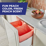 Kitchen cabinet pull-out showing two bins lined with peach-colored trash bags and a 'fun peach color' banner