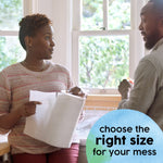 Two people in a kitchen holding and showing a Bounty paper towel sheet with a blue circular callout