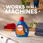 Persil detergent bottle on a laundry room counter with folded towels and headline 'WORKS IN ALL MACHINES'