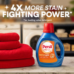Persil Oxi+ detergent bottle on countertop beside folded red towels with kitchen background and headline text