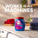 Laundry room scene with Persil pod container on counter and text stating works in all machines