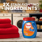 Persil Ultra Pacs tub on a countertop next to folded red towels with laundry room backdrop