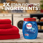 Persil Ultra Pacs tub on a countertop next to folded red towels with bold ingredient claim text