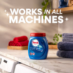 Persil Ultra Pacs tub on a laundry room counter with folded towels and large text reading 'Works in All Machines'.