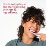 Smiling person brushing teeth with text highlighting 'just 12 ingredients' on a white background