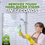 Woman wearing yellow gloves cleaning a shower door with Lime-A-Way bottle visible and headline text