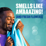 Person smelling a freshly laundered shirt with headline text ‘SMELLS LIKE AMAAAZING!’ and floral note