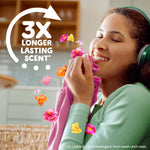 Person smelling a freshly laundered shirt with floating floral icons and '3X longer lasting scent' claim graphic