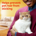 Person holding a fluffy cat against their chest with text 'Helps prevent pet hair from sticking' on a warm background