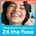 Smiling person holding a light blue Plackers floss pick with branding and text about removing plaque with twice the floss