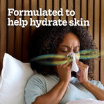 Person in bed holding a tissue to their nose with 'Formulated to help hydrate skin' headline and motion graphics