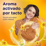 Smiling person hugging themselves amid swirling golden scent visuals and text about touch-activated scent release