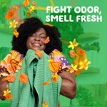 Joyful person hugging green towels with orange floral scent graphics and headline ‘Fight odor, smell fresh’