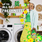 Smiling person in a laundry room holding a Gain Scent Booster bottle with floral graphics and freshness text overlay.