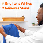 Person holding a blue garment with overlay text 'Brightens Whites Removes Stains' promoting laundry cleaning results.