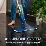 Person using Bona spray mop on dark tiled floor with visible refill bottle in handle, caption says all-in-one system