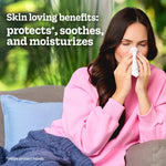 Seated person blowing their nose into a tissue with overlay text listing skin-loving benefits