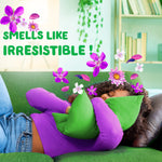 Person lying on a green couch hugging a green pillow with purple flowers and headline 'SMELLS LIKE IRRESISTIBLE !' styling for Gain Moonlight Breeze scent.