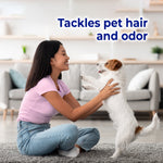 Lifestyle image of a person playing with a small dog on a rug with text about tackling pet hair and odor.