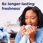 Close-up of smiling person inhaling freshly laundered fabric with headline '6x longer-lasting freshness*'