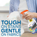 Person spraying a Shout Advanced Gel bottle onto fabric with caption tough on stains gentle on fabrics