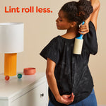 Person using a lint roller on a black shirt covered in pet hair with text reading 'Lint roll less.'