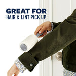 Person using a lint roller on a jacket sleeve with copy reading 'Great for hair & lint pick up' on a white background.