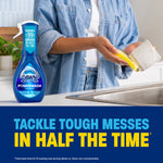 Lifestyle image of a person washing a mug at a sink with a Dawn Platinum Plus Powerwash bottle in the foreground